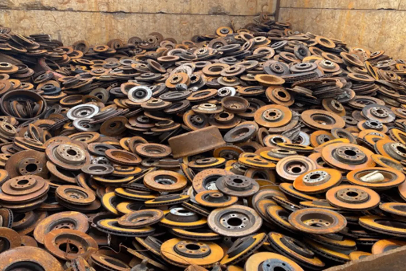Container full of used brake discs for recycling